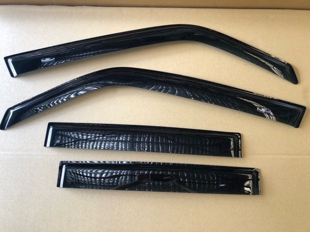 Toyota Aurion Weather Shields, set of four laid out on box, close angle