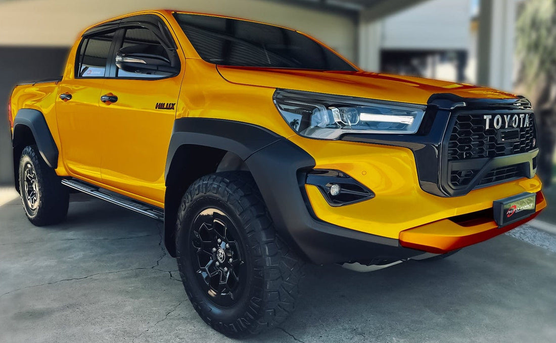 Close-up of a HIC Australia  Injection-Moulded Tinted Weather Shields flush-mounted on a Hilux’s windows, showcasing its sleek fit and UV-resistant clarity.