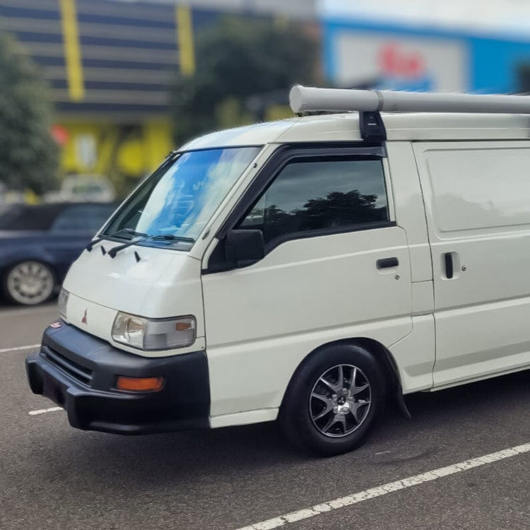 HIC black-tinted weather shields for Mitsubishi Delica 1986–1993 — UV-resistant visors shaped for vintage fitment with 3M adhesive backing